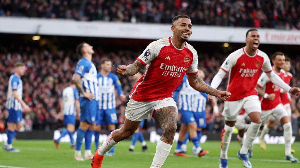 Soccer-Arsenal move top of the league with 2-0 win over Brighton